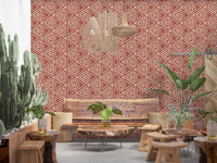 Nested cream triangles tiled over rust terracotta in this mudcloth wallpaper
