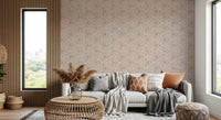 Frayed triangle outlines lend the dusty rose mudcloth wallpaper a gathered, tribal feel
