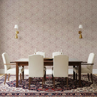 A triangle mudcloth wallpaper in dusty rose lifting a relaxed Dining room