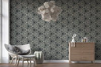 Hallway feels calmer in a study dressed with charcoal mudcloth wallpaper
