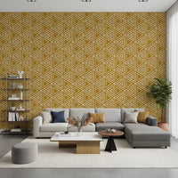 Aged, sun-faded mustard gives the boho mudcloth wallpaper its mellow tone