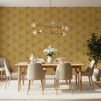 Geometric triangle repeats fill a quiet Dining room in mustard mudcloth wallpaper