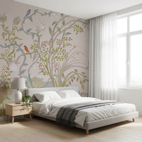 Quiet bedroom scheme shaped by the chinoiserie wall mural and its songbird vines