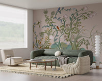 Tall stems and rose blooms open behind a relaxed lounge in the chinoiserie wall mural