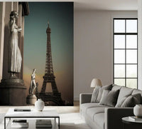 Eiffel Tower lifts above the living room in this Parisian Grandeur wall mural