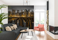 Dark river waters and wooden posts characterize this Skyline wall mural