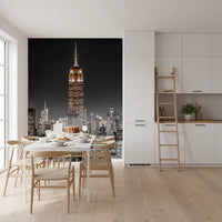 Dining room areas benefit from the imposing height of the skyscraper Glow wall mural.
