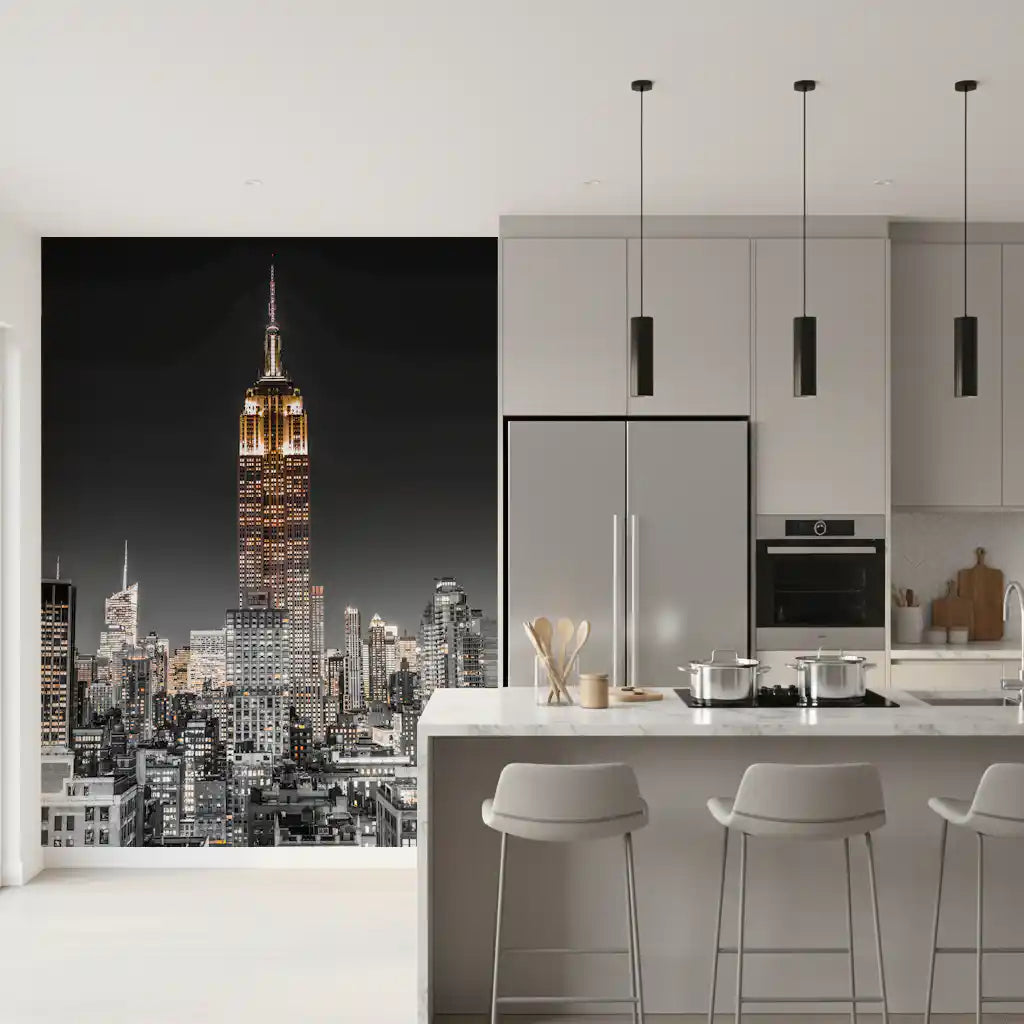 The Empire Glow: NYC Night in Grayscale Gold wall mural updates a modern kitchen.