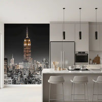 The Empire Glow: NYC Night in Grayscale Gold wall mural updates a modern kitchen.