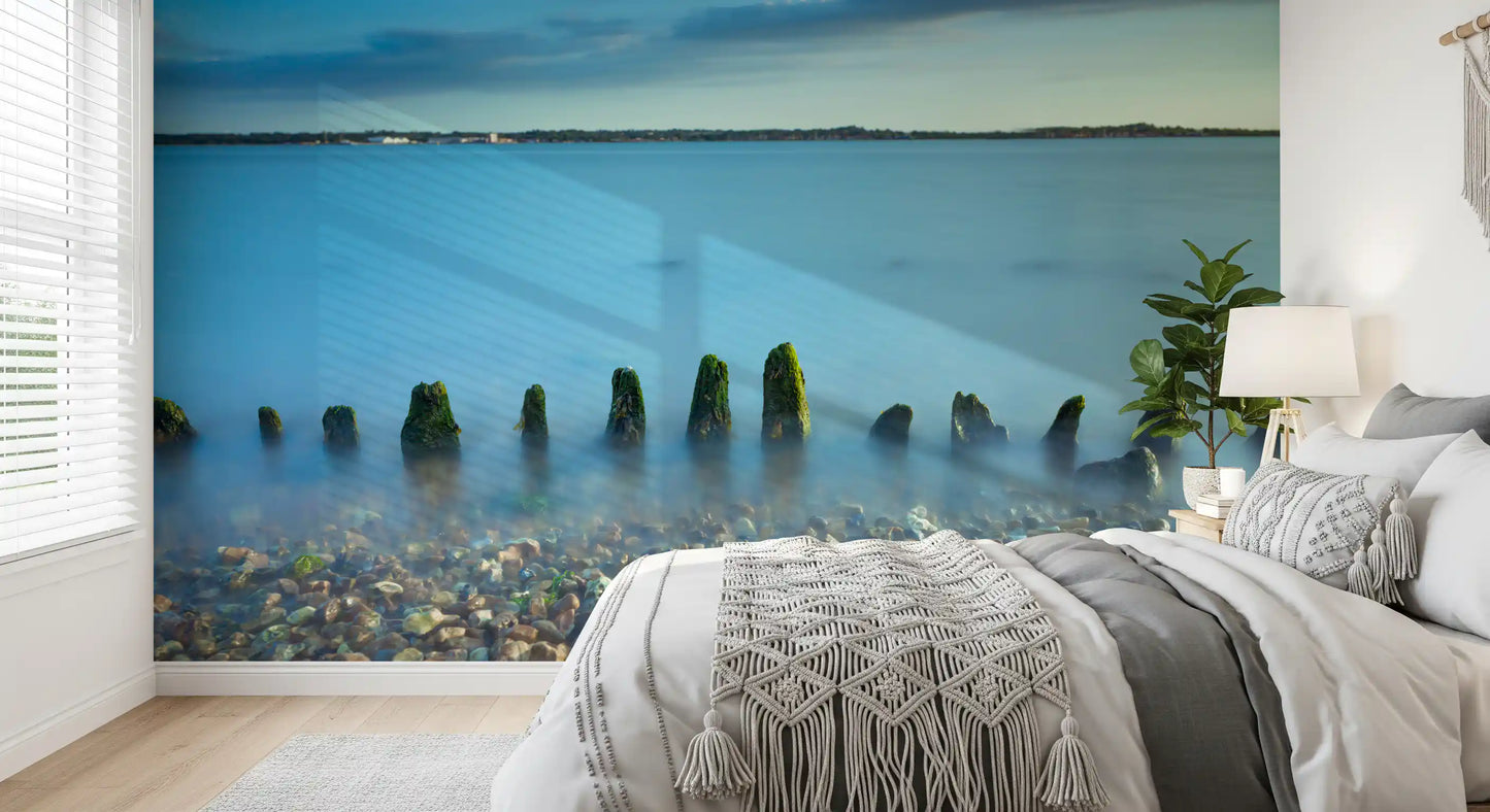 Used in a Bedroom, the Ethereal Coastline wall mural opens to a wide pebble shore.