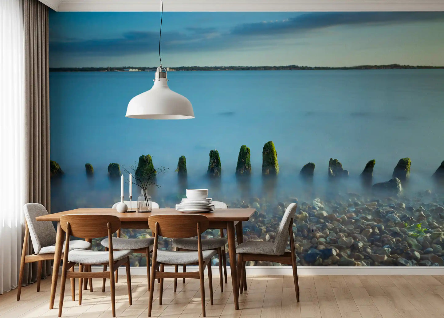 Cool blue and weathered green wrap a Dining room in the Coastline landscape wall mural scene.