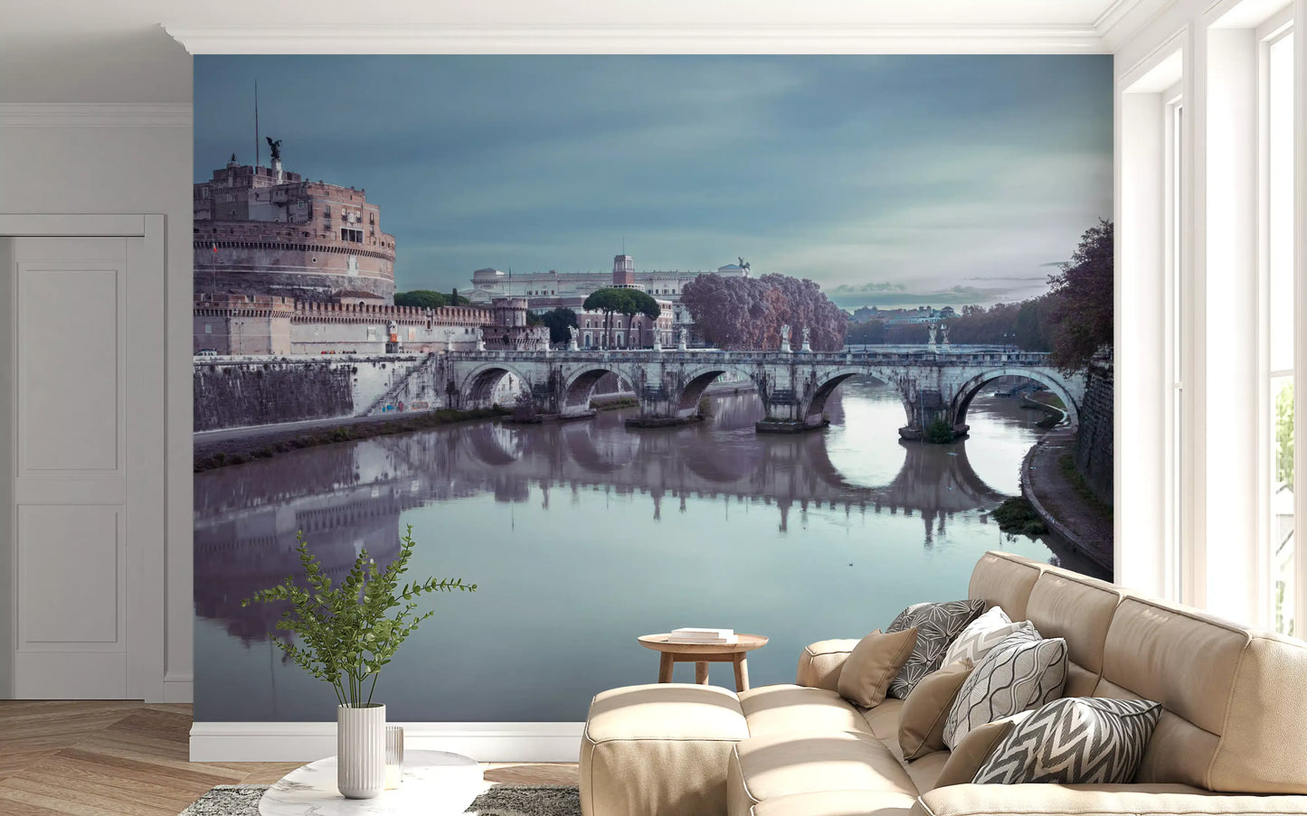 Wide cityscape view stretches across the Castel Sant'Angelo wall mural under cloud cover.