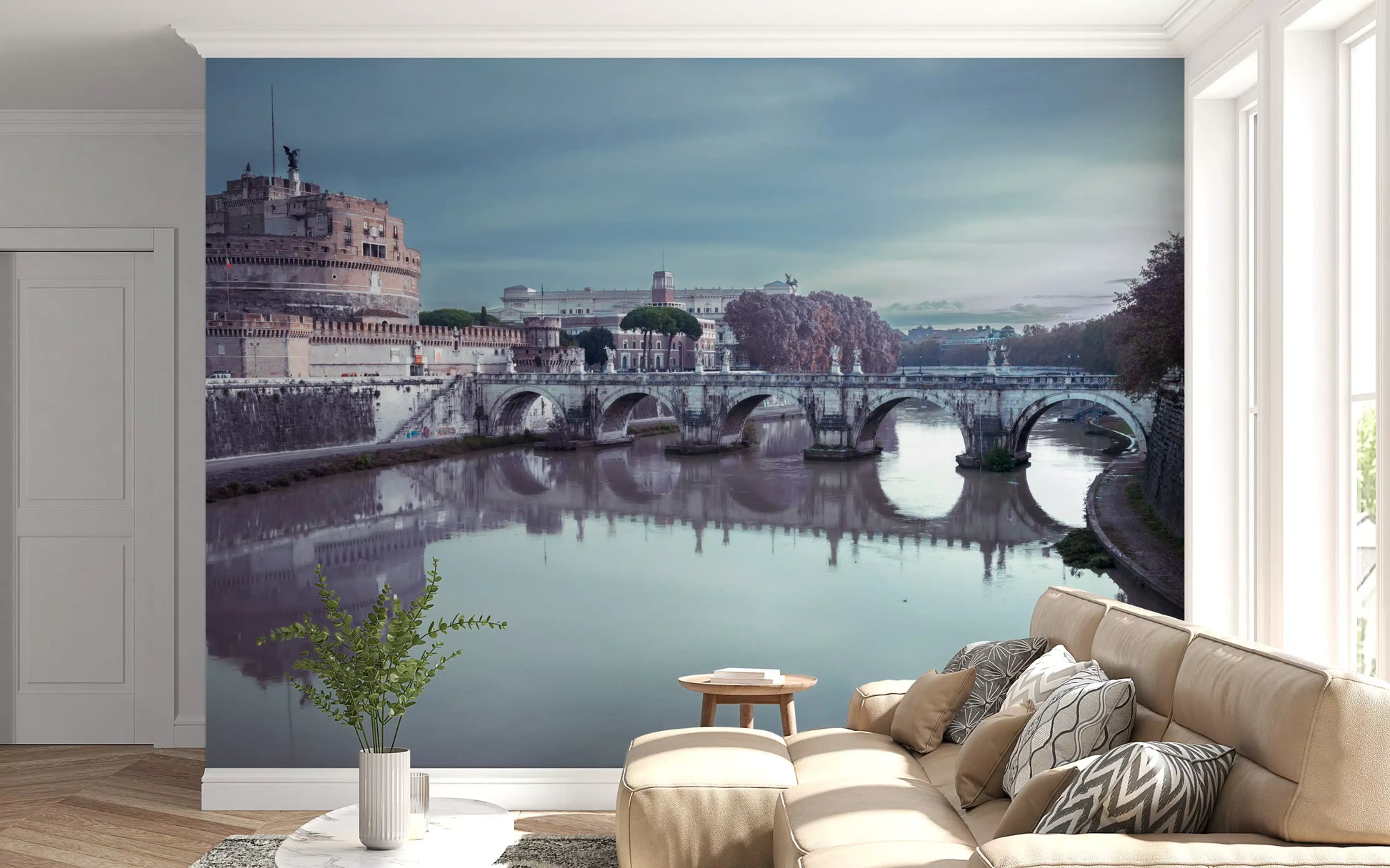 Wide cityscape view stretches across the Castel Sant'Angelo wall mural under cloud cover.