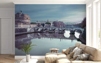 Wide cityscape view stretches across the Castel Sant'Angelo wall mural under cloud cover.