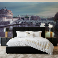 Late-day calm wraps a bedroom in the Castel Sant'Angelo wall mural.