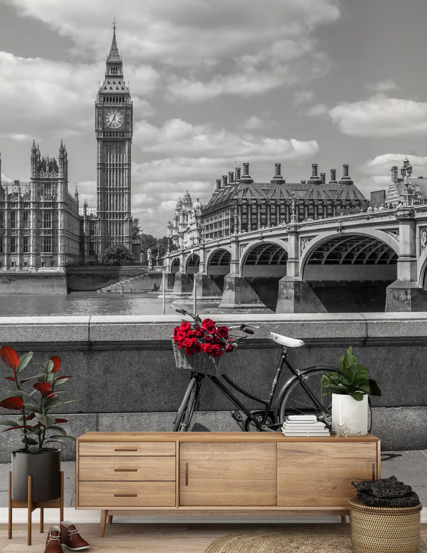 Tied to a bicycle, red roses face the London Love wall mural skyline.