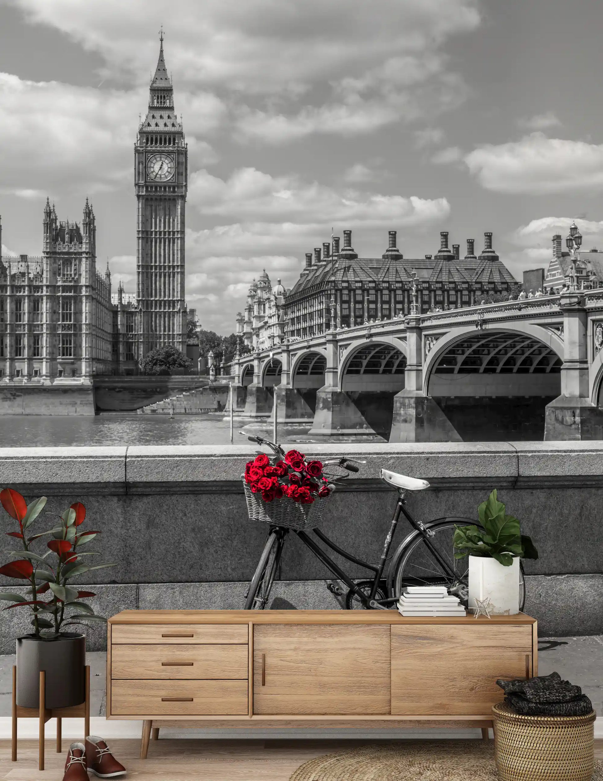 Tied to a bicycle, red roses face the London Love wall mural skyline.