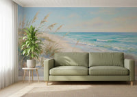 Painted ocean and dune grass give a living room calm Coastal Dreamscape wall mural feel.
