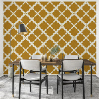 Mustard and white ogee curves lift a dining room with Textured Lattice Trellis wallpaper.