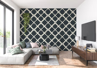 Textured lattice geometric wallpaper displays off-white wavy lines over dark grey.