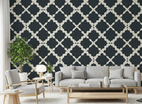 Wide living room spaces benefit from the striking textured lattice wallpaper installed here.