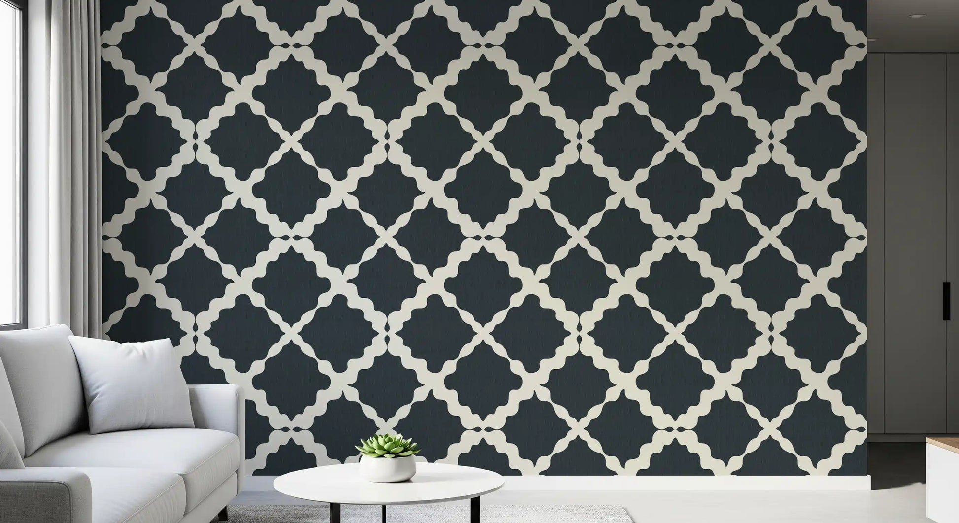 The textured charcoal wallpaper provides deep graphic rhythm for an open living room.