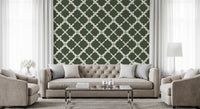 Green trellis wallpaper accents a quiet Living room.