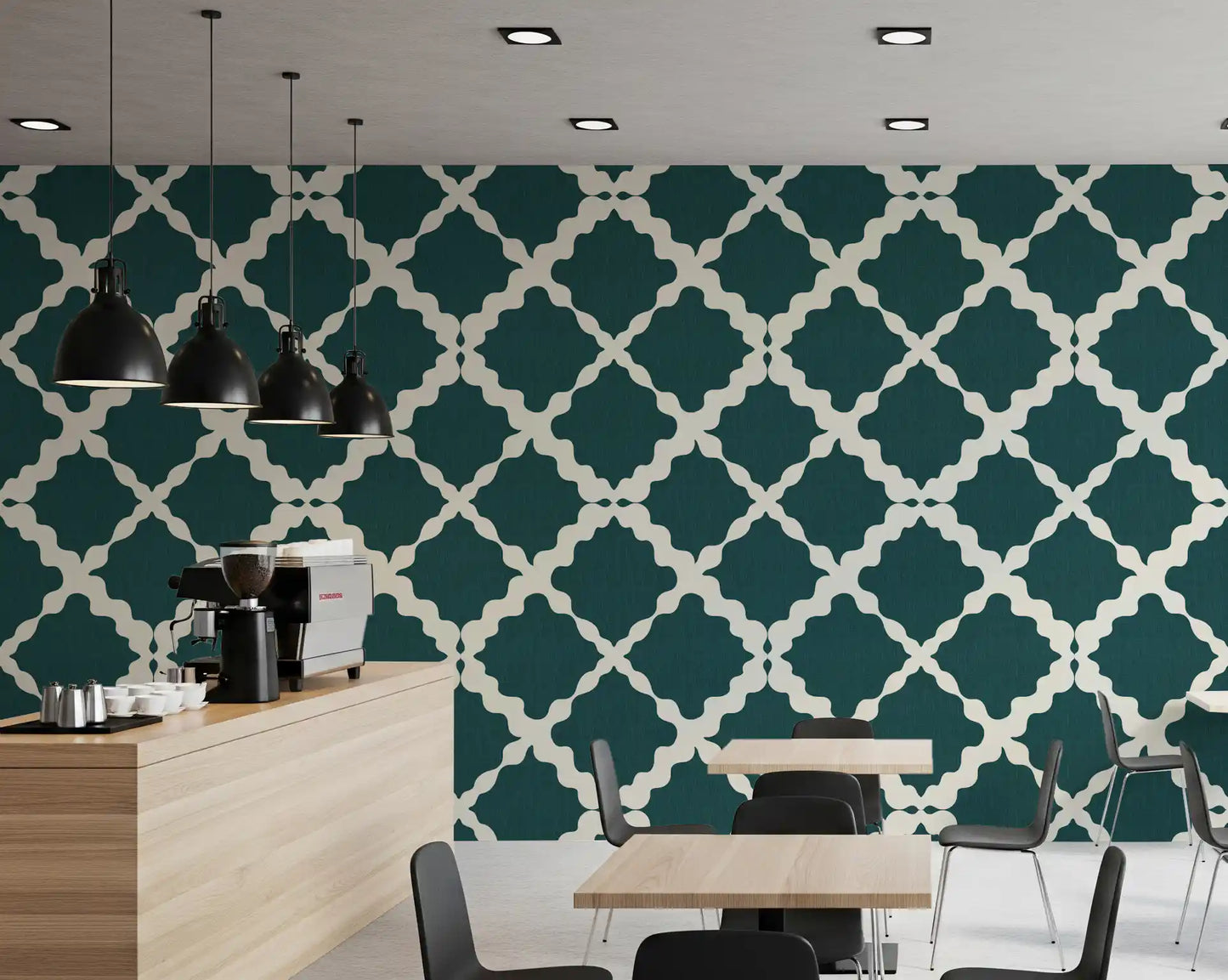 Cream quatrefoil patterning over deep teal wallpaper keeps a Café quietly modern