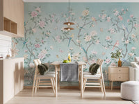 Pastel aqua and rose run through this Chinoiserie Aviary wall mural over a dining room.