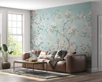 Serene Chinoiserie Aviary wall mural opens a lounge with peony stems and songbirds.