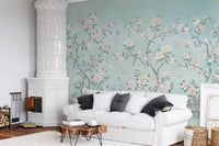 Birds and butterflies sweep above this Chinoiserie Aviary wall mural in a living room.