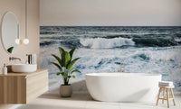Large blue water swells display on the Ocean Scapes Wall Mural within the bathroom.