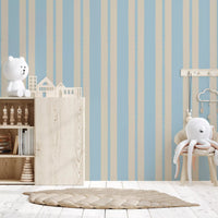 Gentle blue and beige tones of the Serenity wallpaper in a Nursery area .