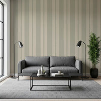 Living room fitted with Muted Scallop & Dot Stripes Wallpaper behind a dark sofa