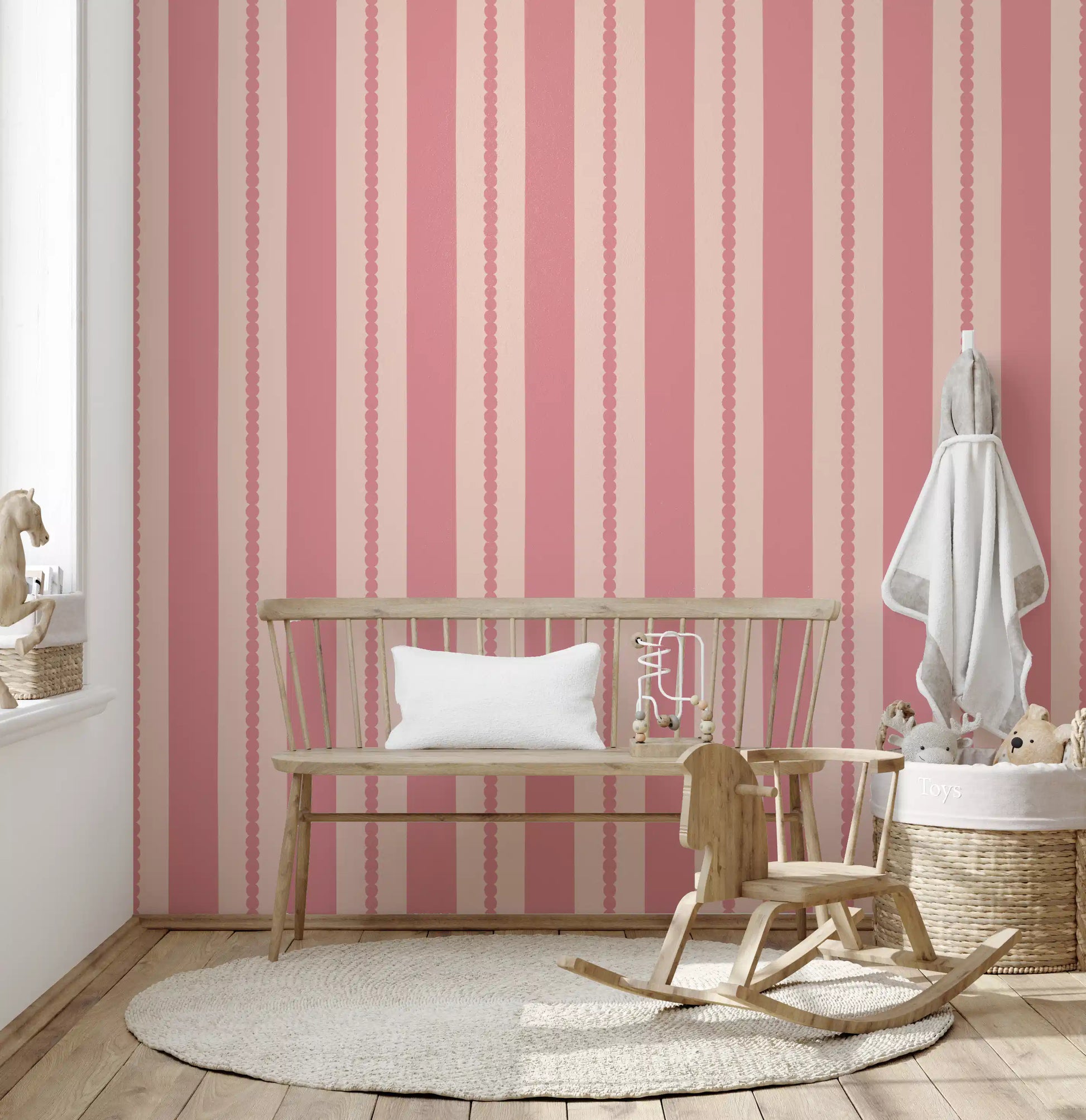 Blush Scallop Stripes Wallpaper revealing straight and undulating vertical pink borders.