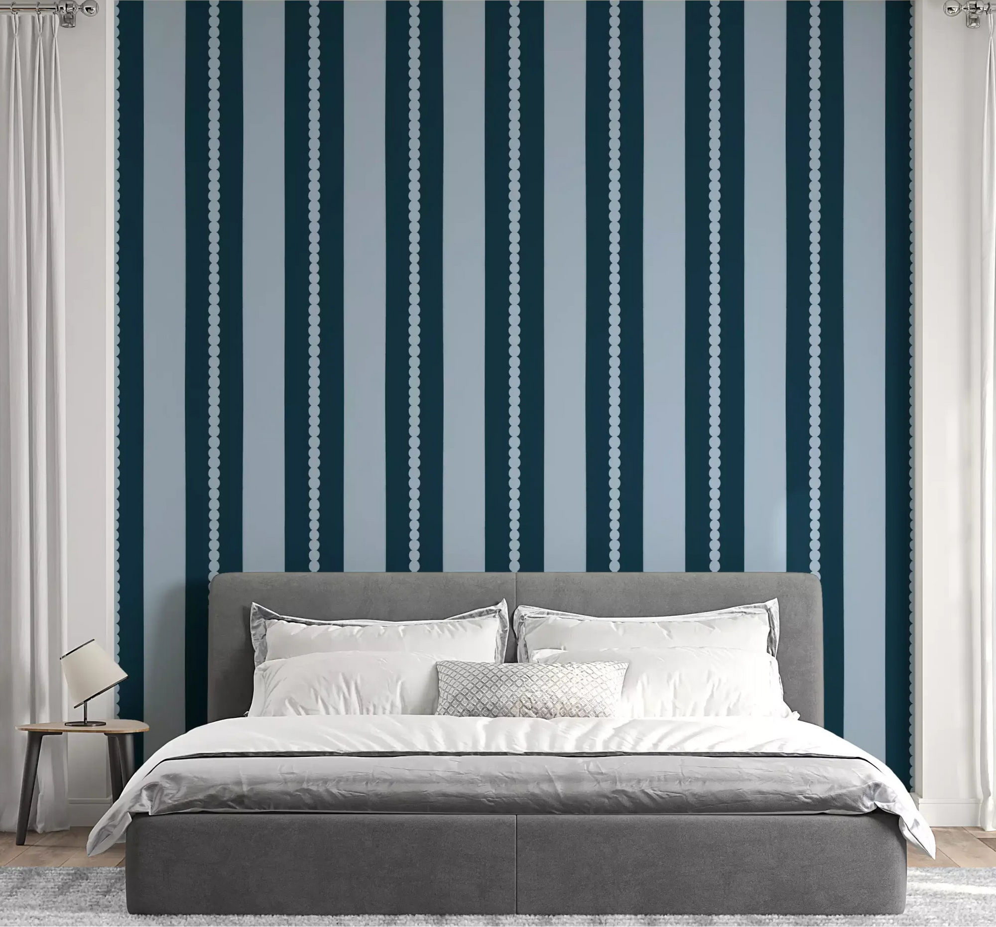 A navy striped Scallop & Dot Vertical Harmony Wallpaper⁠ lines the bedroom.