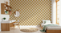 The Golden Ripple Checks Wallpaper showcases a wavy geometric square motif.