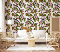 Botanical motifs give a Living room quiet garden feel via Birds and Blossoms wallpaper.