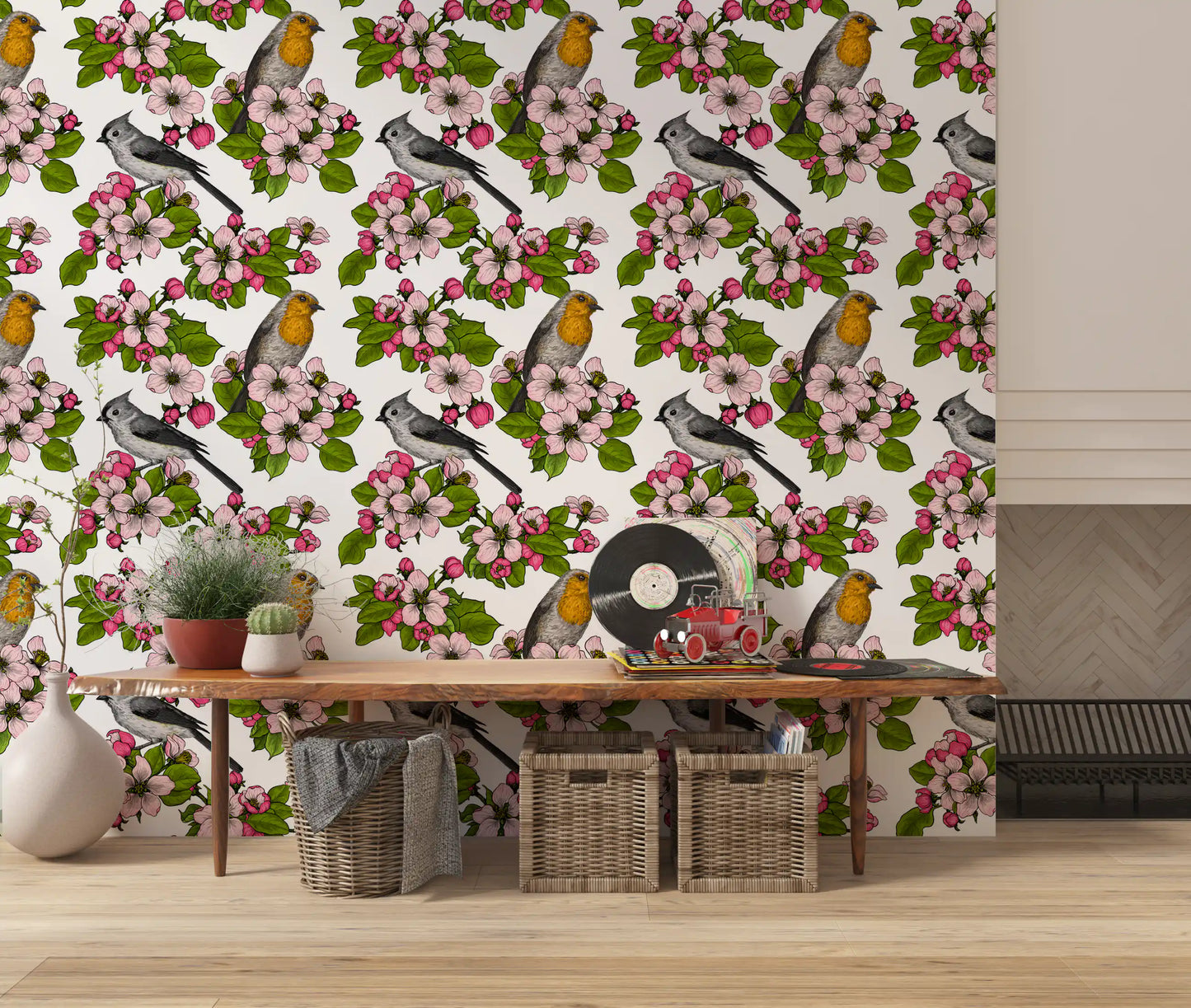 Ivory ground in Birds and Blossoms wallpaper keeps a lounge airy with bloom motifs.