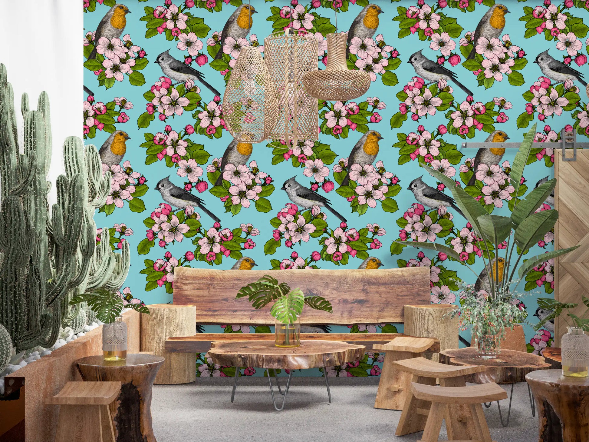 Turquoise base spreads behind blossom sprays and small birds on the wallpaper