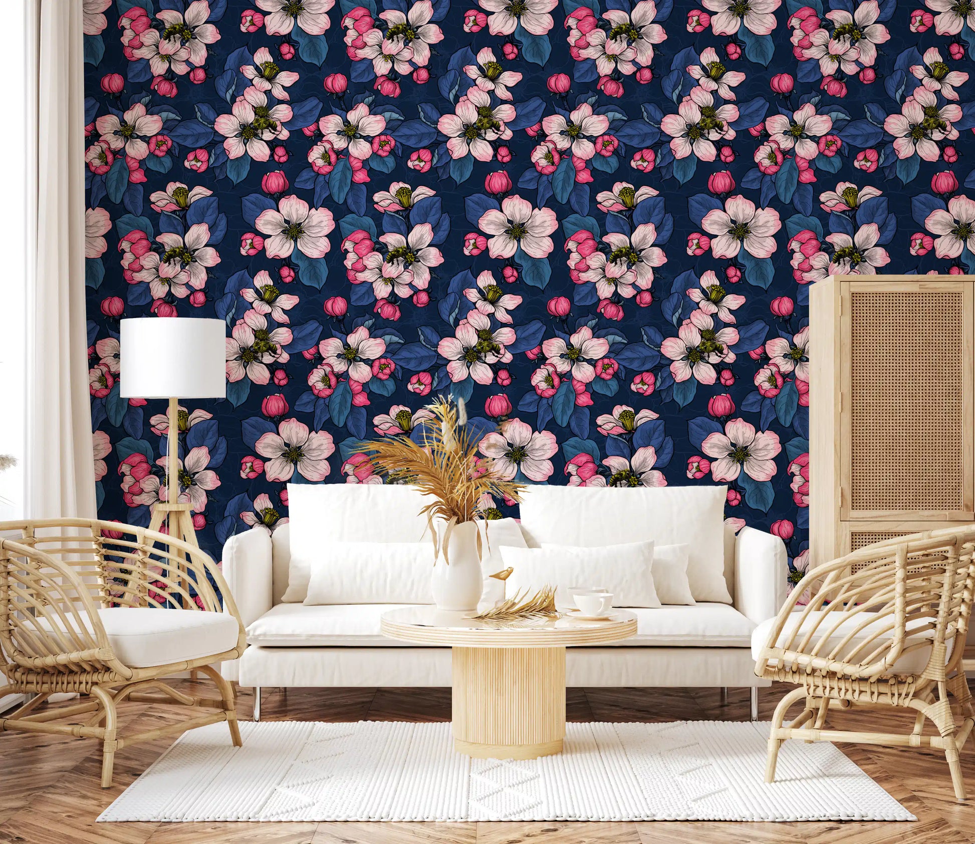 Bright botanical patterns shape the Apple blossom on dark blue wallpaper of a modern lounge.