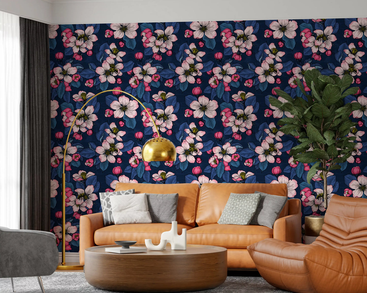 A Living room area highlights large pink petals on the dark blossom wallpaper.