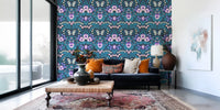 The enchanting Dollhouse garden wallpaper stretches across a quiet lounge.