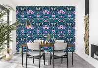 Our intricate pansies wallpaper serves as a dark backdrop for a modern dining room.
