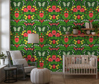 Green botanical motifs from the butterflies wallpaper line this long modern Nursery.