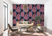 Tall lilac clusters appear upon the fitted wallpaper enclosing a quiet Lounge area 