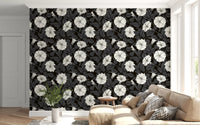 Large white blossoms pop against the dark tones of moonflowers wallpaper.