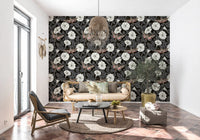 A Living space feels grounded by the dark Moonflowers and sphinx moths wallpaper.