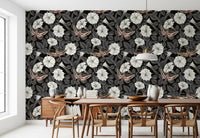 Dark foliage grounds the white blossoms in the Moonflowers and sphinx moths wallpaper.