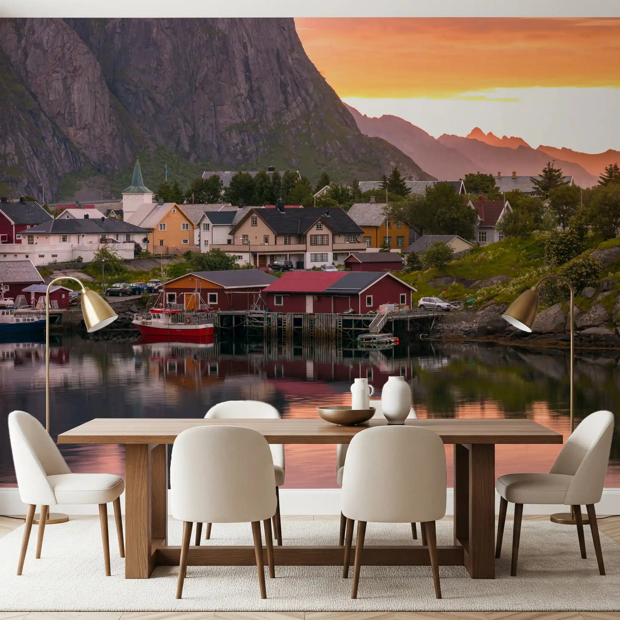 A dining room illuminated by the Lofoten Village Sunset & Fjord Wall Mural.